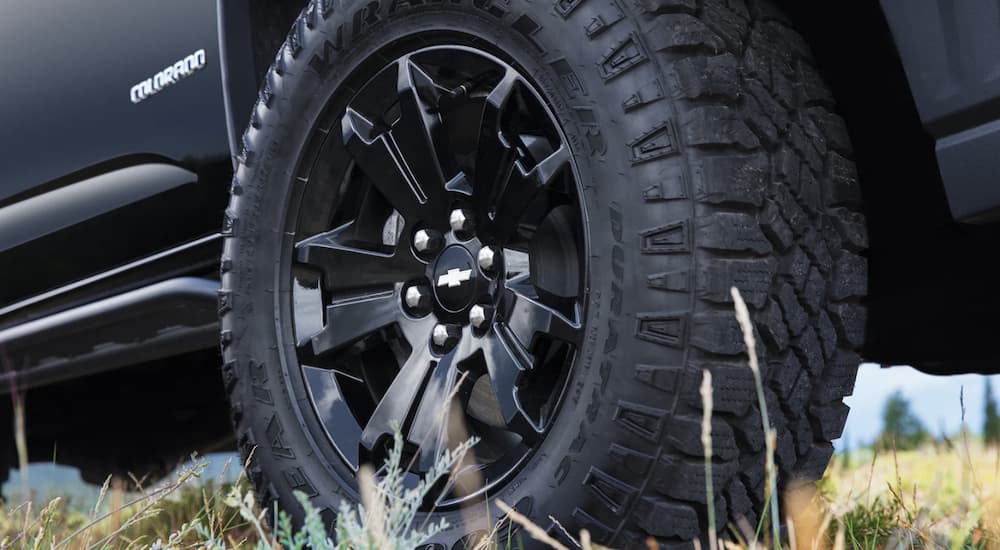 The black tire of a 2022 Chevy Colorado WT is shown in close up.