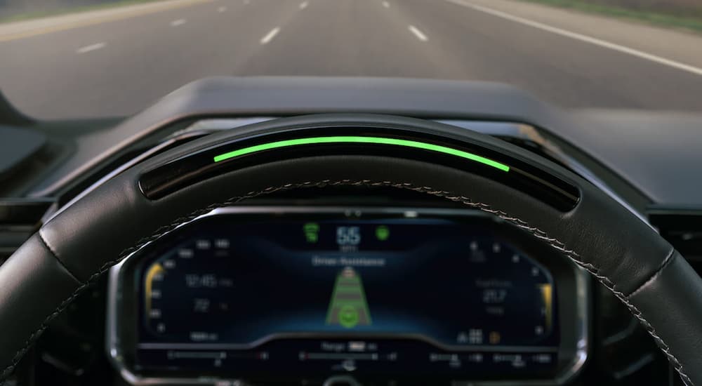 The black interior of a 2022 Chevy Silverado 1500 LT shows the dashboard in close up.