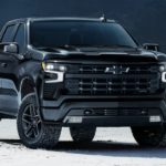 A black 2022 Chevy Silverado 1500 LT is shown parked on a salt flat.