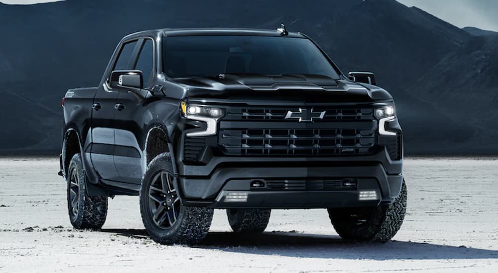 A black 2022 Chevy Silverado 1500 LT is shown parked on a salt flat.