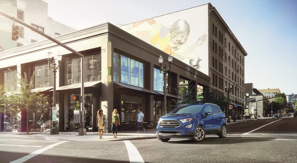 A blue 2022 Ford Ecosport is shown from the front at an angle on a city street.
