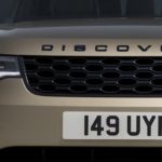 A close up of the front of a tan 2022 Land Rover Discovery is shown.