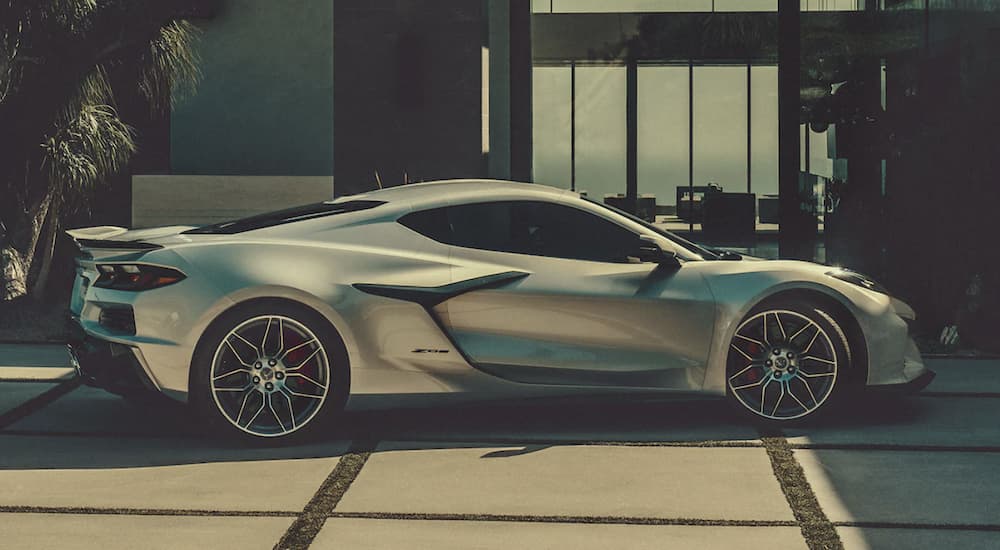 A silver 2023 Corvette Z06 is shown from the side.