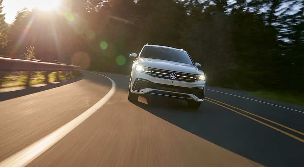 A white 2022 Volkswagen Tiguan is shown from the front after leaving a VW Tiguan dealership.