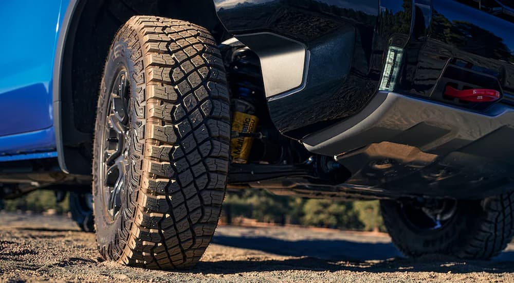 A close up of the wheel of a blue 2022 Chevy Silverado ZR2 is shown.