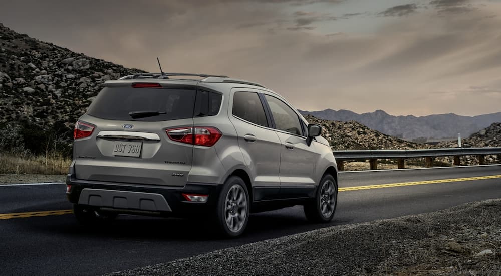 A silver 2020 Ford Ecosport is shown from the rear at an angle.