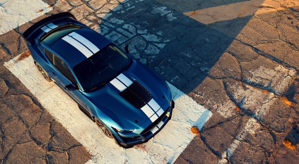A blue 2020 Ford Mustang Shelby GT500 is shown from a high angle.