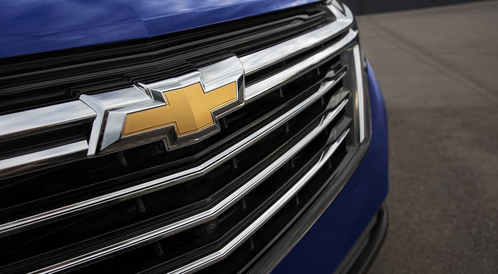 A close up of the grille on a blue 2023 Chevy Equinox LS is shown.