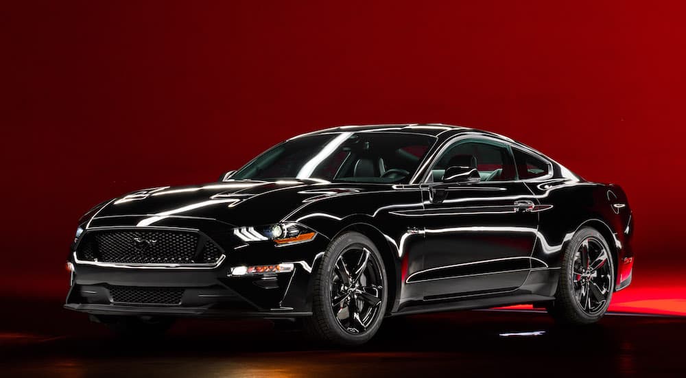 A black 2022 Ford Mustang GT Nite Pony is shown from the front at an angle.