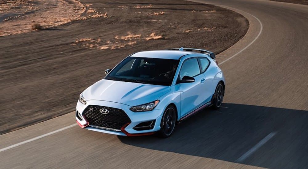 A white 2022 Hyundai Veloster N is shown from the front at a high angle.