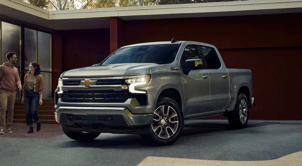 A grey 2023 Chevy Silverado 1500 Z71 is shown parked in front of a building.