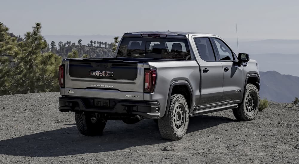 A grey 2023 GMC Sierra 1500 AT4X is shown from the rear.