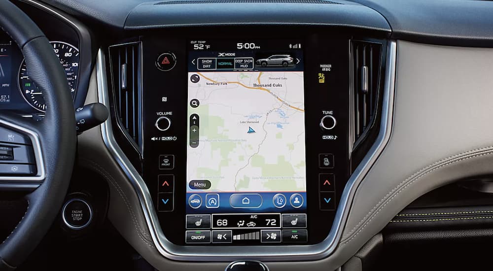 The black interior of a 2023 Subaru Outback shows the infotainment screen in close up.