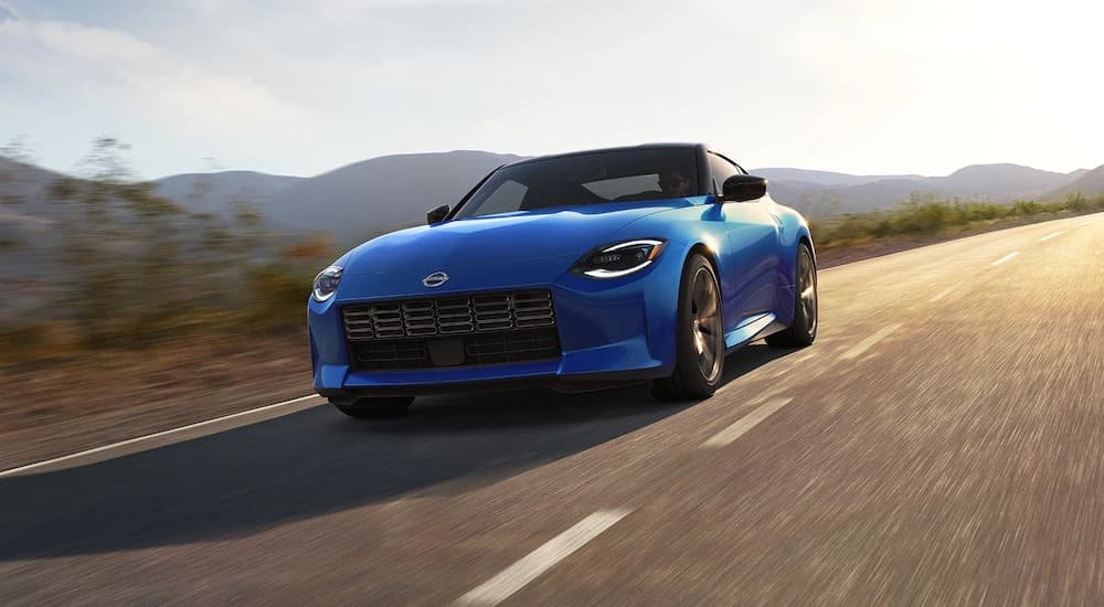 A blue 2023 Nissan Z is shown from the front at an angle.