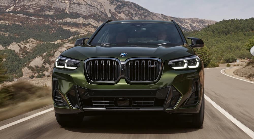 A green 2023 BMW X3 is shown from the front after leaving a dealer that had a BMW X3 for sale.