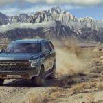 A 2022 Chevy Tahoe Z71 is shown from the front while driving off-road after leaving a Chevrolet Tahoe dealer.