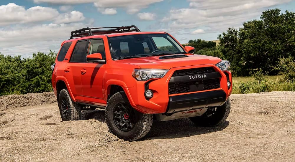 An orange 2023 Toyota 4Runner TRD Pro is shown from the front at an angle.