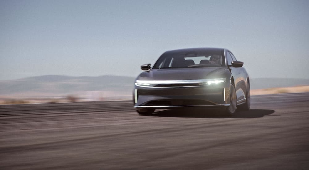 A grey 2022 Lucid Air GT is shown from the front.