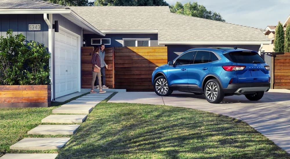 A blue 2022 Ford Escape is shown from the rear at an angle after leaving a dealer that had a Ford Escape for sale.