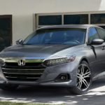 A grey 2021 Honda Accord Touring 2.0T is shown parked in a driveway.