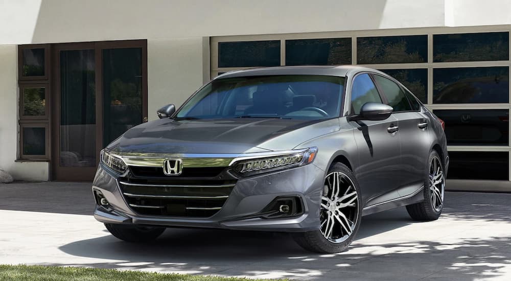 A grey 2021 Honda Accord Touring 2.0T is shown parked in a driveway.