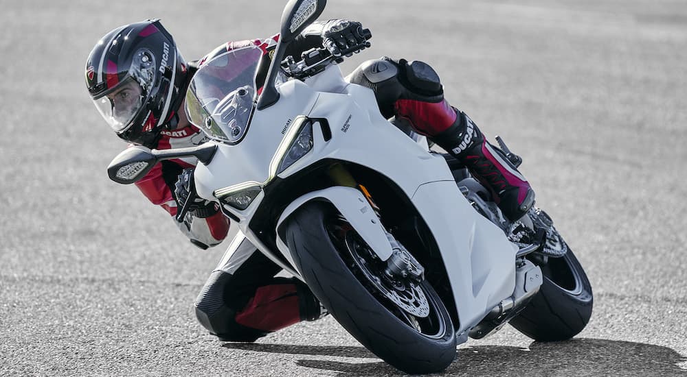 A white 2022 Ducati Supersport 950s is shown from the front while cornering.