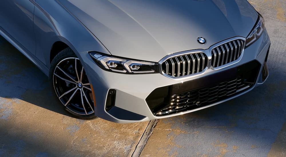 A close up of the grille on a grey 2023 BMW 3 Series is shown.