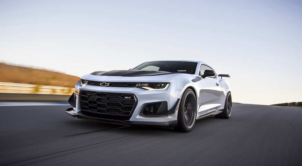 A white 2019 Chevy Camaro ZL1 1LE is shown from the front at an angle.