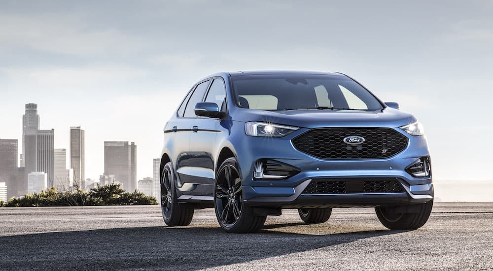 A blue 2019 Ford Edge ST is shown from the front at an angle.