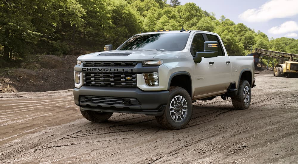 A white 2020 Chevy Silverado 2500 HD Work Truck is shown from the front at an angle.