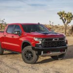 A red 2023 Chevy Silverado 1500 ZR2 is shown from the front at an angle.