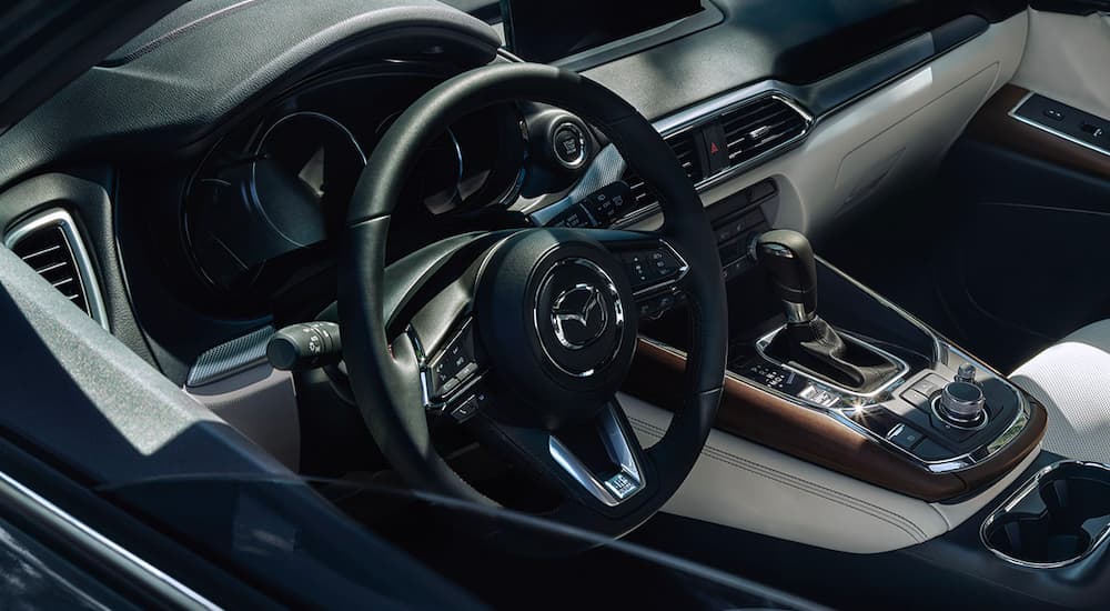 A close up shows the dash and interior in a 2023 Mazda CX-9.