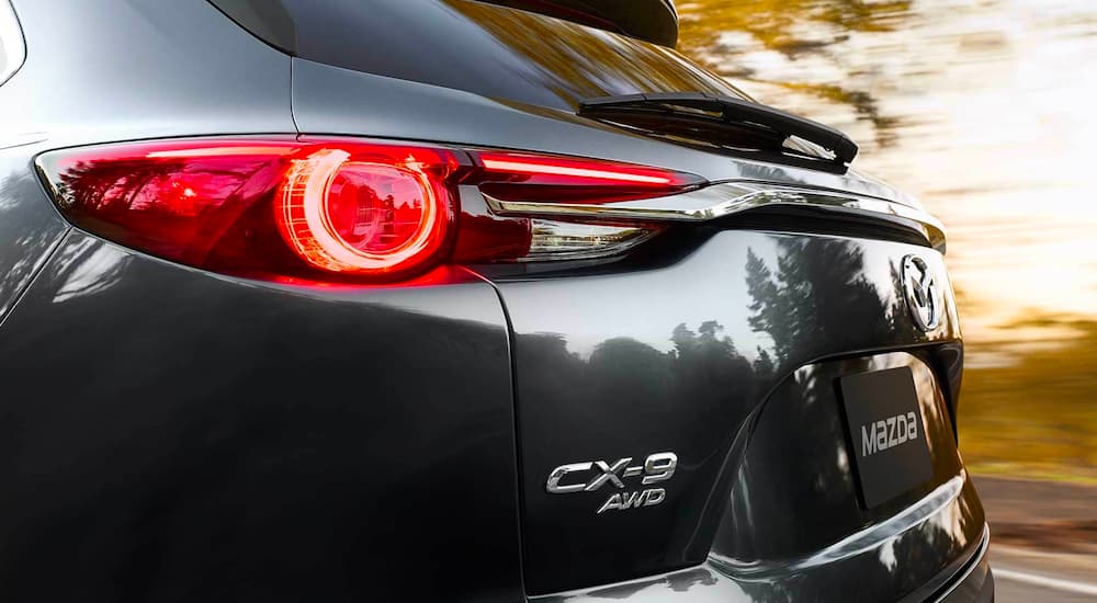 A close up shows the driver side taillight on a grey 2023 Mazda CX-9. 