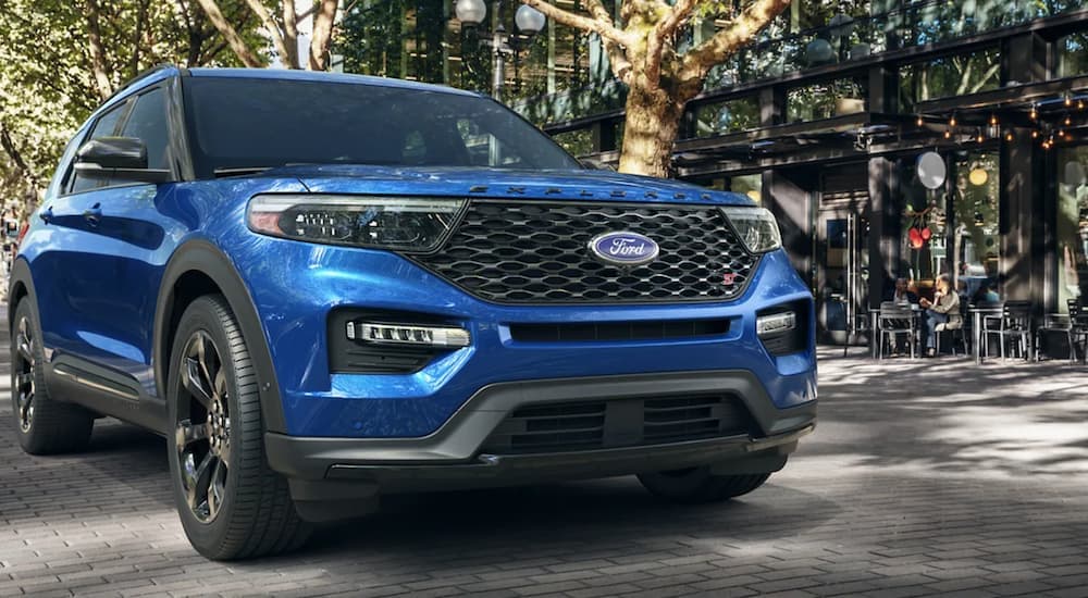 A blue 2022 Ford Explorer ST is shown from the front after leaving a Chevy Traverse dealer.