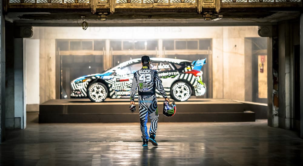 Ken Block is shown approaching a Ford Focus.