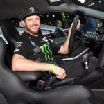 Ken Block is shown smiling in a car.