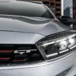 A close up of the headlight of a silver 2023 Kia Forte GT is shown.