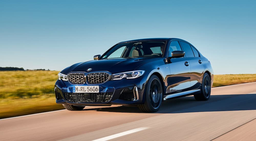 A blue 2023 BMW M340D is shown from the front at an angle.