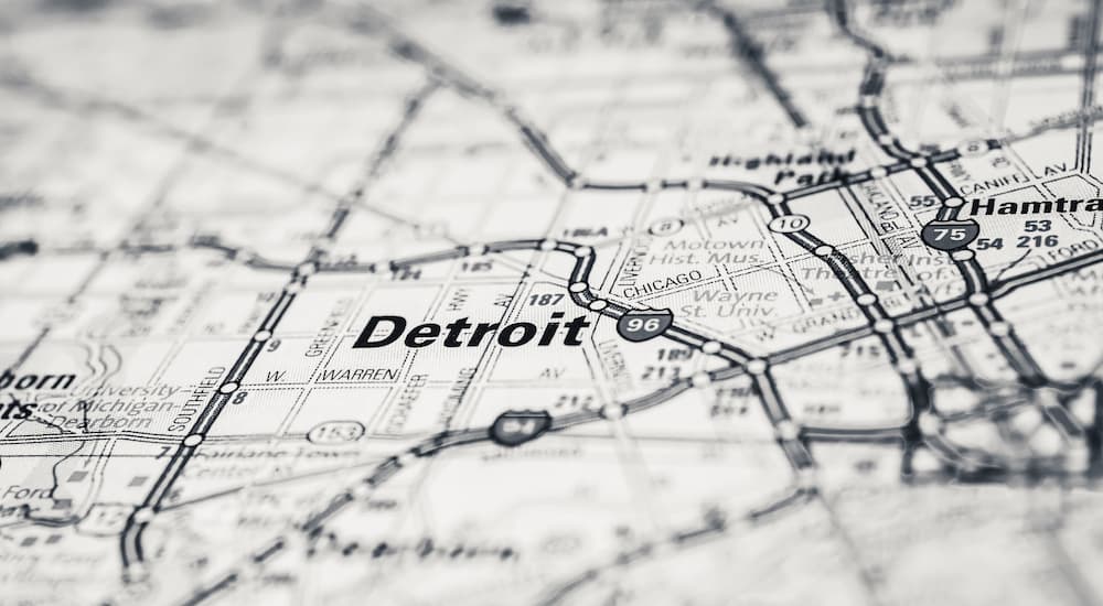 A map shows the city of Detroit near many used car lots in Jackson, MI.