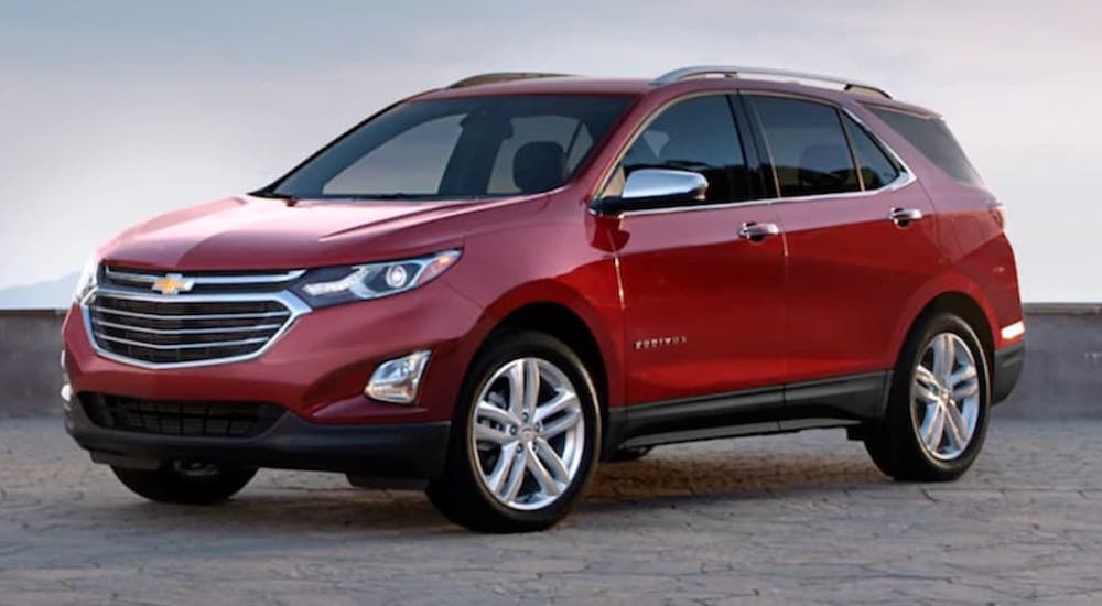 A red 2020 Chevy Equinox is shown angled left.