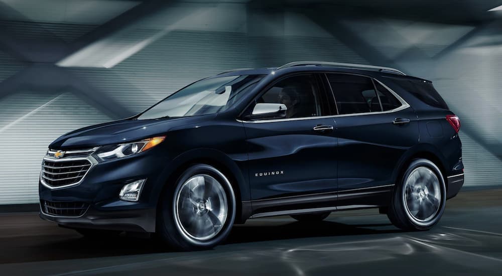 A blue 2020 Chevy Equinox is shown from the side.