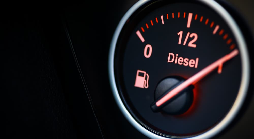 A close up of the fuel gauge on a diesel truck is shown.