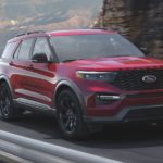 A red 2021 Ford Explorer ST is shown from the front at an angle.