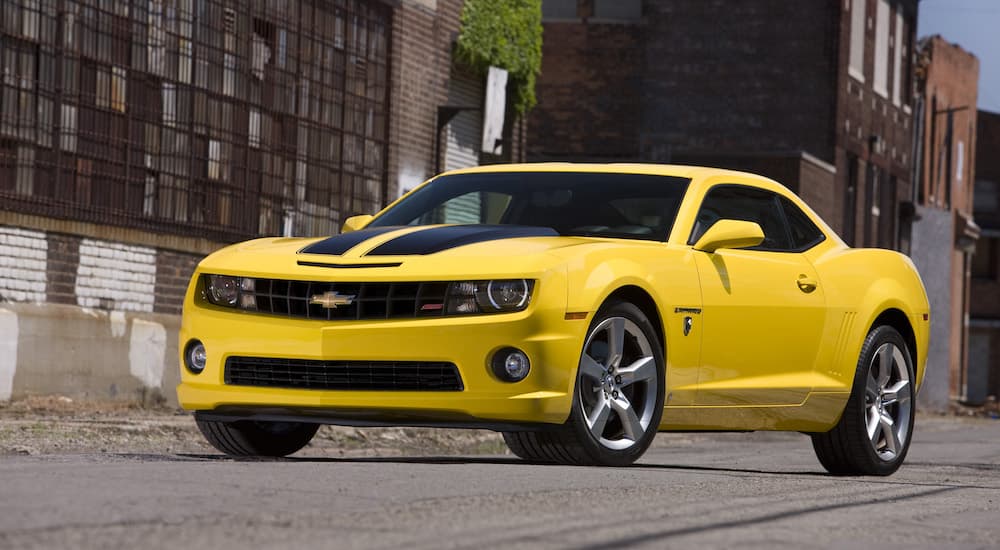 A yellow 2010 Chevy Camaro SS Transformers Edition is shown from the front at an angle after leaving a Chevy Camaro dealer.
