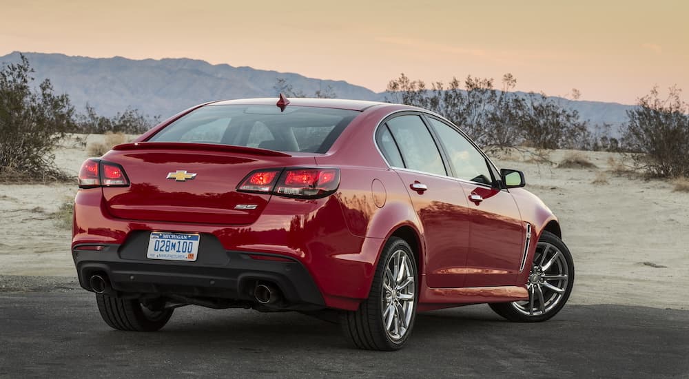 A red 2015 Chevy SS is shown from the rear at an angle.