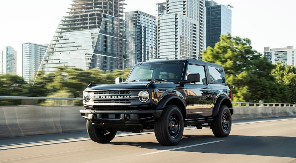 A black 2021 Ford Bronco is shown from the front at an angle.