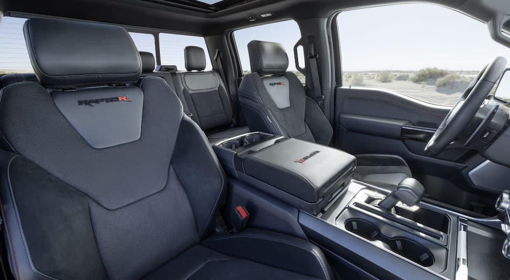 The interior of a 2023 Ford F-150 Raptor R is shown from the passenger seat.