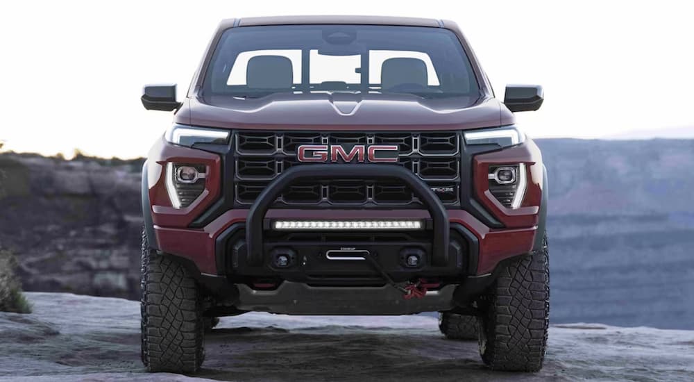 A red 2023 GMC Canyon AT4X is shown from the front.
