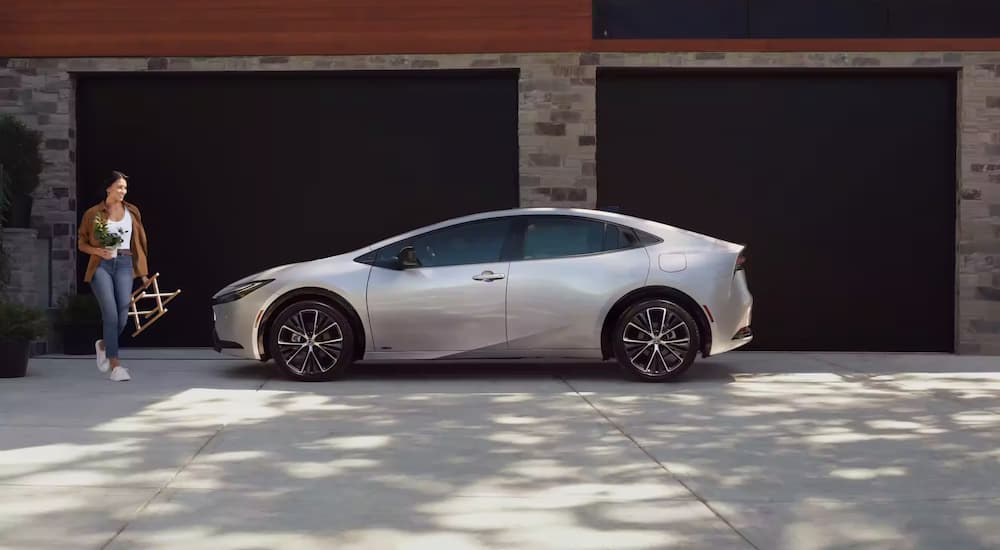 A silver 2023 Toyota Prius is shown from the side after leaving a Toyota dealership near you.