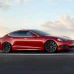 A red 2020 Tesla Model S is shown from the side.